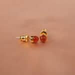 Pair of carnelian stud earrings with deep orange glow