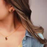 Model wearing the tiger eye studs, showing natural glow and minimal elegance