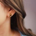 Model wearing the tiger eye studs, showing natural glow and minimal elegance