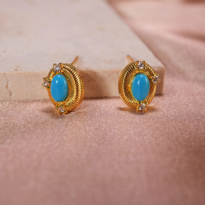 Close-up of turquoise stone texture and gold bezel detailing