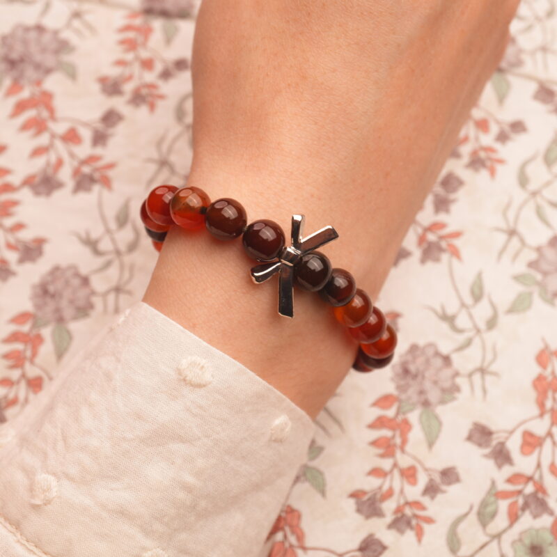 8mm Red Agate Heart Bracelet on wrist, worn in a minimalist daily style