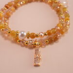 Close-up of Tiger Eye and White Crystal beads showing texture and shimmer