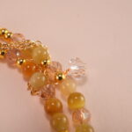 Close-up of Tiger Eye and White Crystal beads showing texture and shimmer