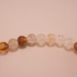 Close-up of faceted citrine and smooth white chalcedony beads