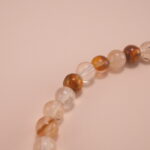 Close-up of faceted citrine and smooth white chalcedony beads