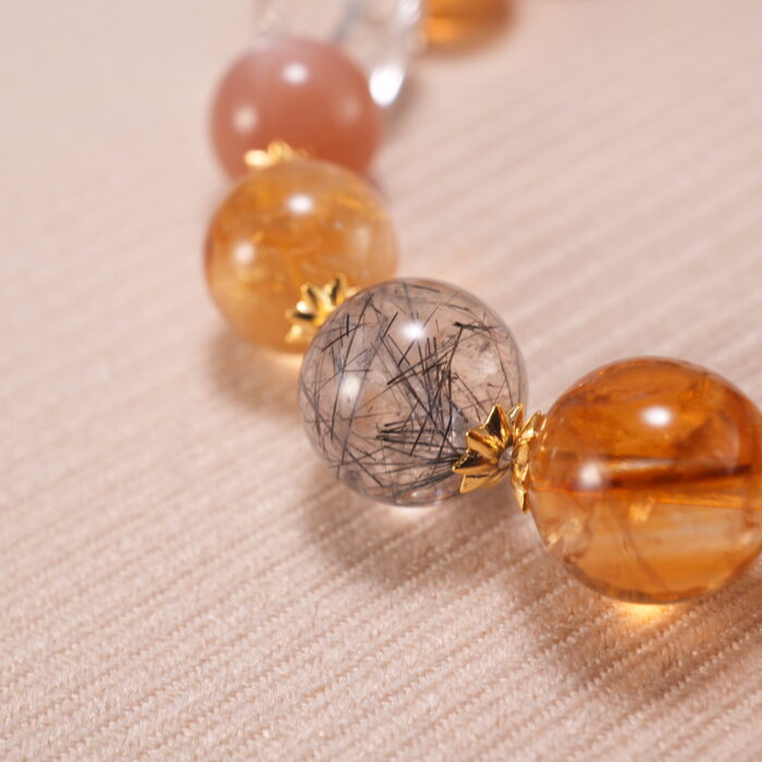 Close-up of faceted citrine beads and smooth gemstone texture