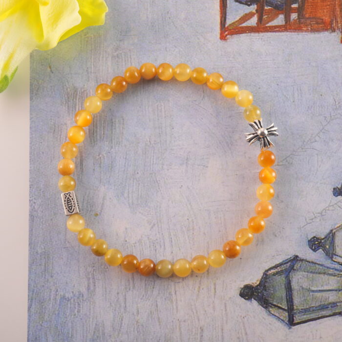 Bracelet placed beside natural decor items