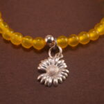 Close-up of cinnabar floral beads and vibrant agate stones
