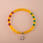 Handmade yellow agate and cinnabar charm bracelet with gold-toned accents
