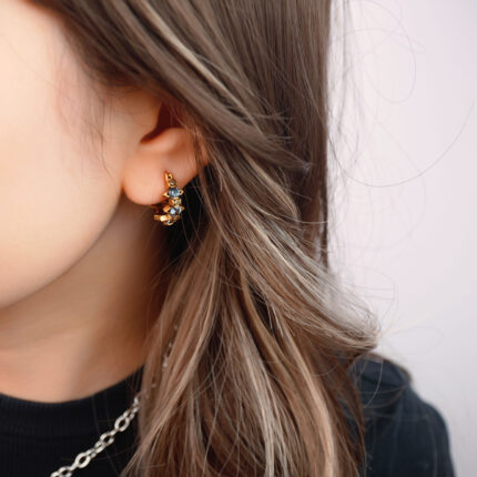 Model wearing the clip-on earrings, showcasing the fit for non-pierced ears