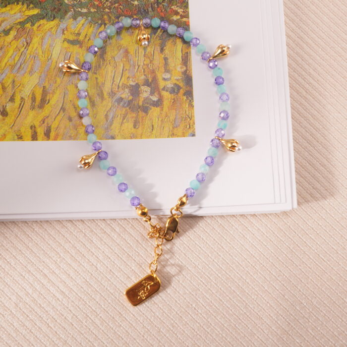 Minimalist aquamarine and amethyst bracelet in a calming meditation setting