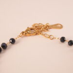 Close-up of genuine black tourmaline beads on adjustable bracelet