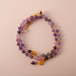 Amethyst double wrap adjustable bracelet with genuine purple amethyst beads on white background