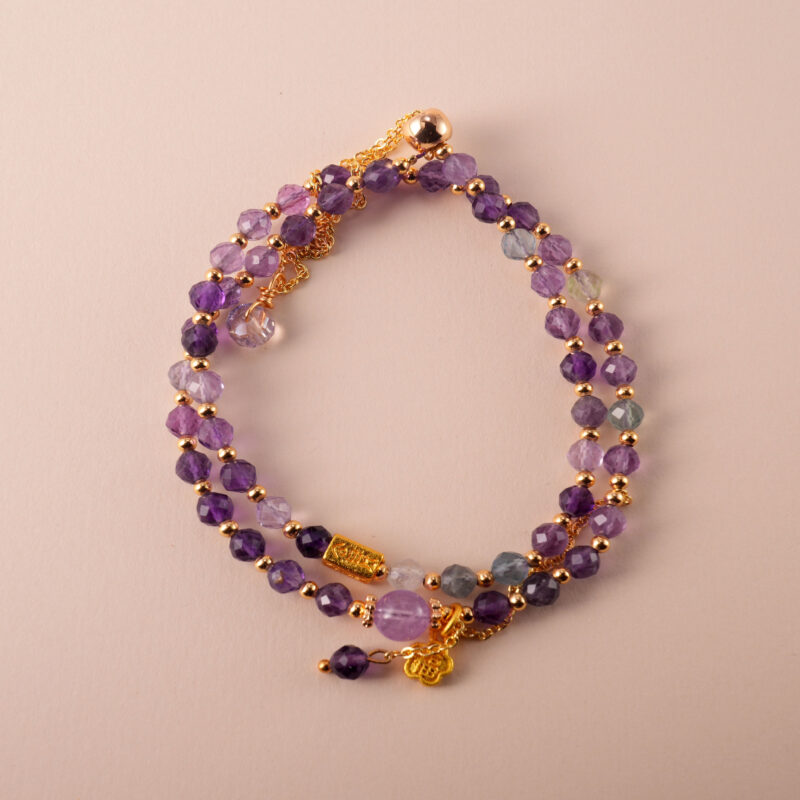 Amethyst double wrap adjustable bracelet with genuine purple amethyst beads on white background