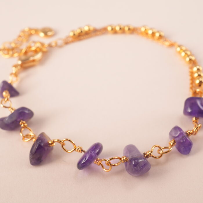 Detailed view of beaded amethyst bracelet design and cord