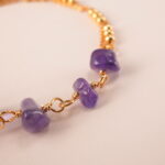 Detailed view of beaded amethyst bracelet design and cord
