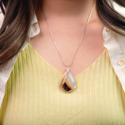 Model wearing the necklace, showing the pendant’s size and natural beauty