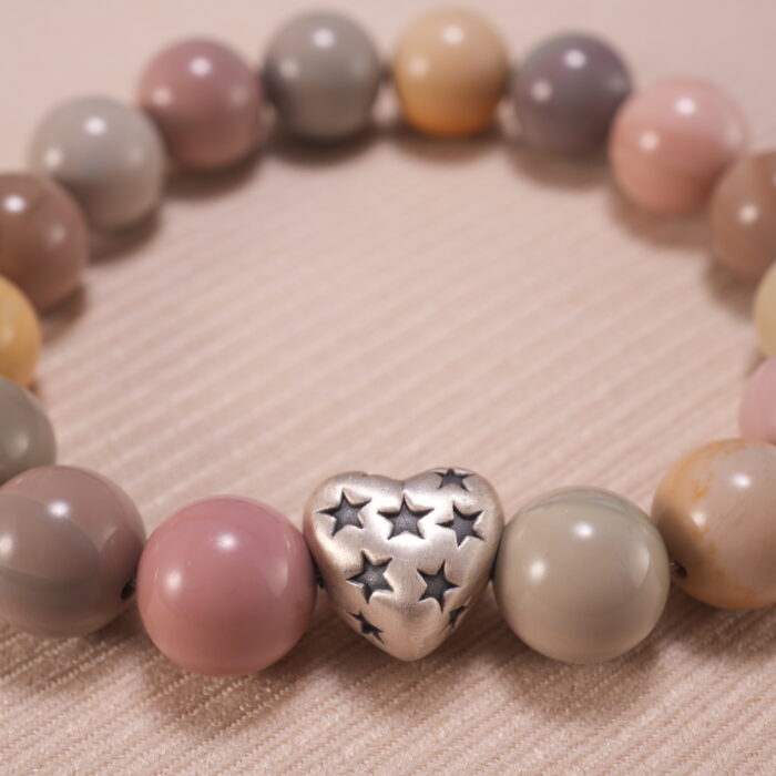 Close-up of natural stone heart bracelet showing handcrafted details