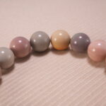 Close-up of natural stone heart bracelet showing handcrafted details