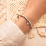 Alashan stone beaded bracelet worn on a wrist, demonstrating its minimalist design and grounding effect