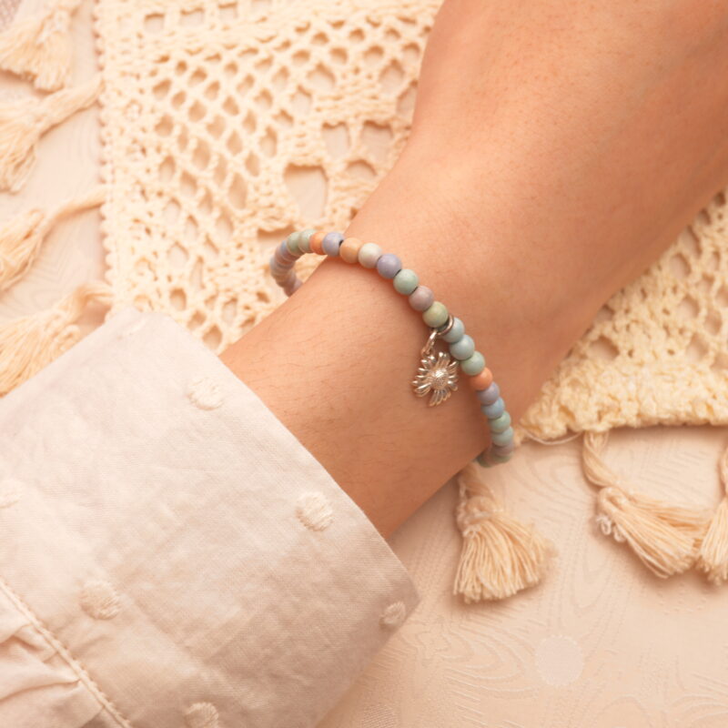 Alashan stone beaded bracelet worn on a wrist, demonstrating its minimalist design and grounding effect