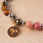 Close-up of Aries Zodiac Bracelet showing gemstone beads and zodiac charm