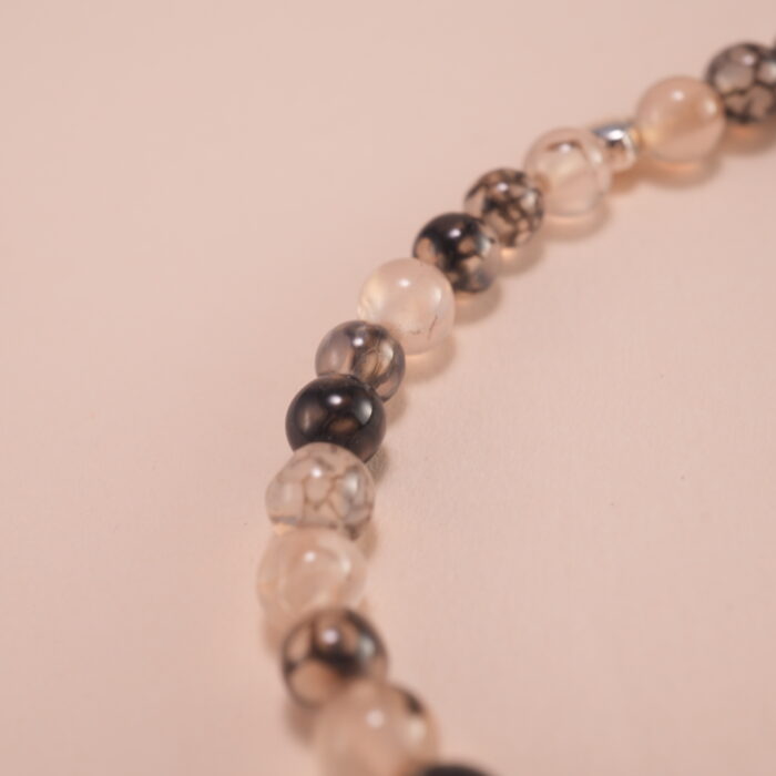 Close-up of black and white chalcedony beads with S925 spacer details