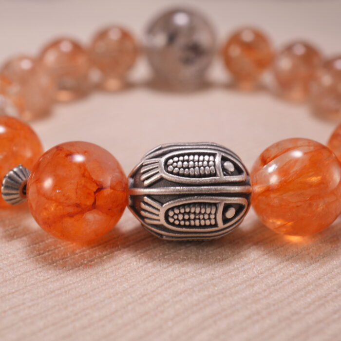 Close-up of Super Seven Bracelet showing gemstone textures and Clear Quartz details.
