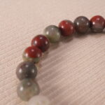Close-up of polished Bloodstone beads with subtle S925 accents