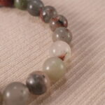 Close-up of polished Bloodstone beads with subtle S925 accents