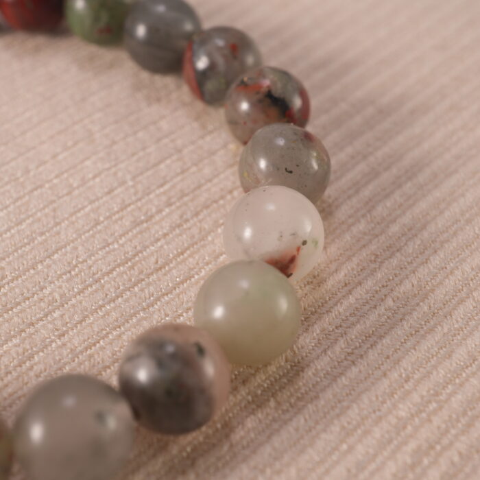 Close-up of polished Bloodstone beads with subtle S925 accents