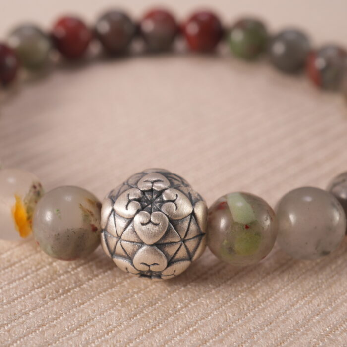 Close-up of polished Bloodstone beads with subtle S925 accents