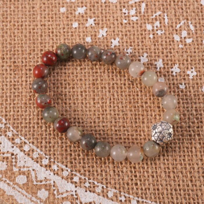 Bracelet placed in a calming, natural setting symbolizing renewal and strength