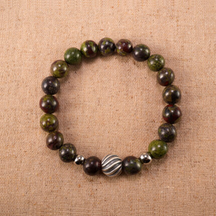 Handmade Bloodstone bracelet displayed on a neutral background, showing natural green-red stone patterns