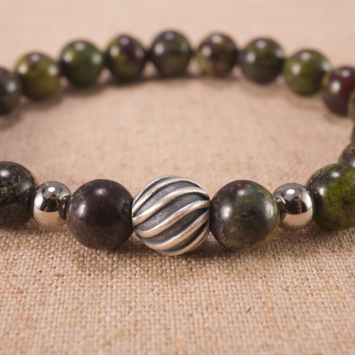Close-up of smooth Bloodstone beads strung tightly for durability