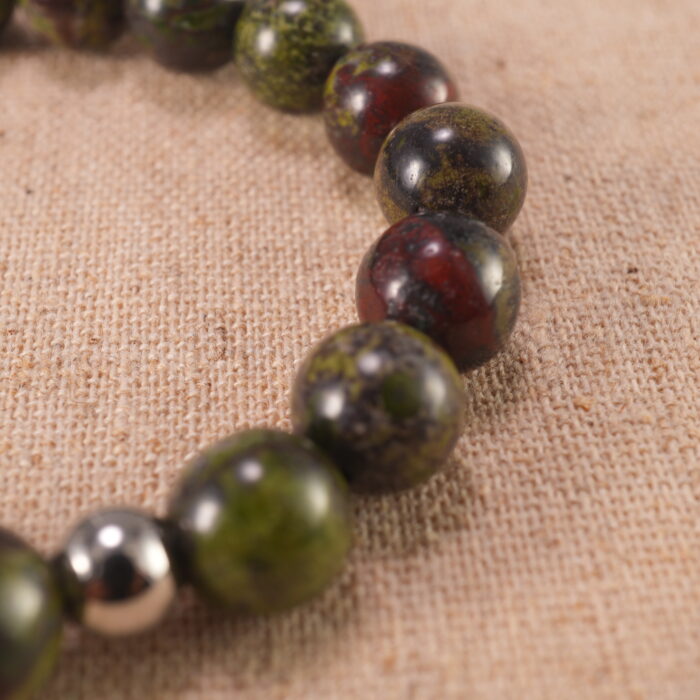 Close-up of smooth Bloodstone beads strung tightly for durability