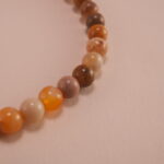 Close-up of landscape stone beads and sterling silver clasp on bracelet