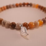 Close-up of landscape stone beads and sterling silver clasp on bracelet