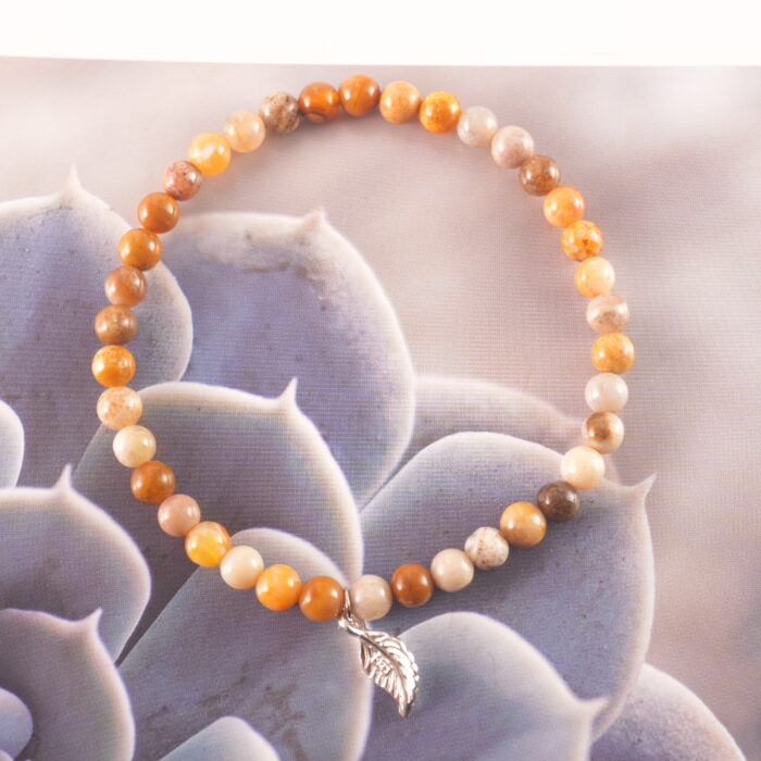 Handcrafted calcite bracelet displayed in a natural setting