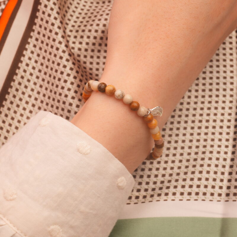 Model wearing handmade calcite gemstone bracelet
