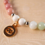 Detailed view of Cancer bracelet beads and elastic cord construction