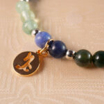 Close-up of gemstone beads and elastic cord on Capricorn bracelet