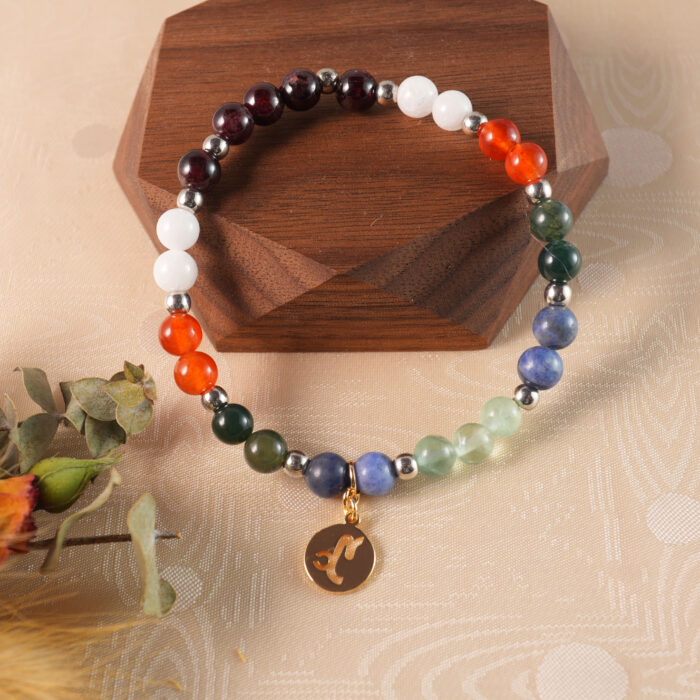 Capricorn birthstone bracelet displayed on rustic wooden surface
