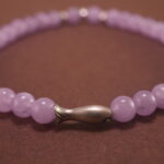 Detailed view of the amethyst beads showing their natural clarity and rich lavender hues