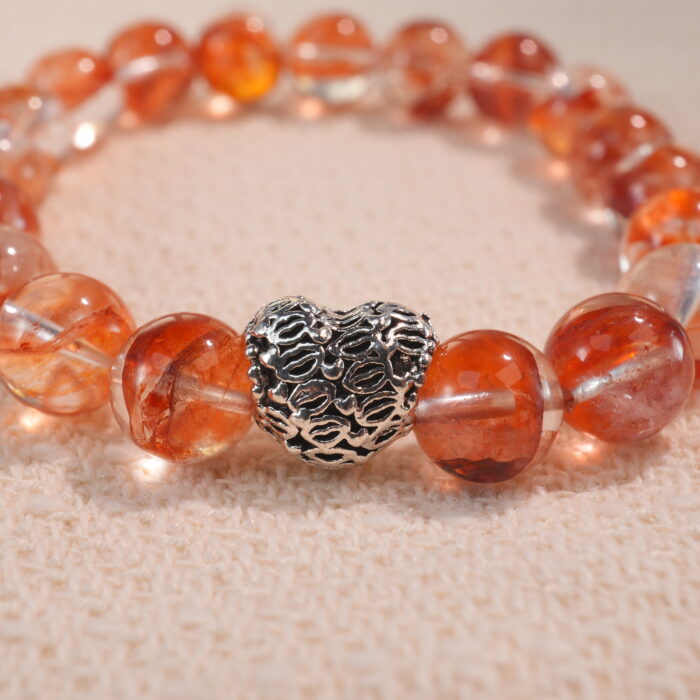 Close-up of 8mm red jelly opal beads in heart-shaped design