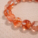 Close-up of 8mm red jelly opal beads in heart-shaped design