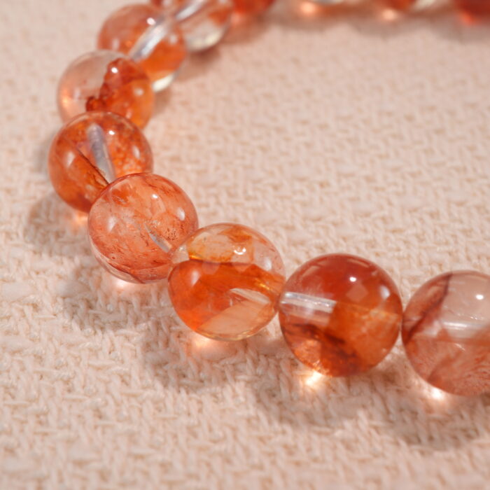 Close-up of 8mm red jelly opal beads in heart-shaped design