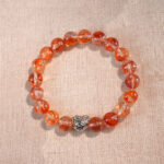 Red jelly opal 8mm heart-shaped bracelet on white background – natural stone jewelry