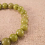 Close-up of Green Alashan Beads and Silver Accents – Revitalizing Crystal Bracelet