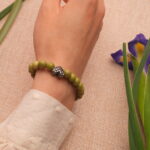 Model Wearing Green Alashan Stone Bracelet – Natural Energy Jewelry on Wrist